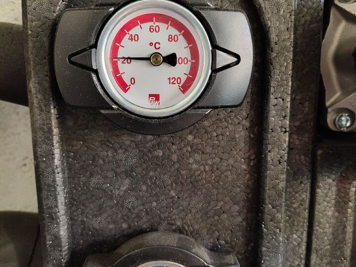 Red and blue dial thermometers. Front close-up.