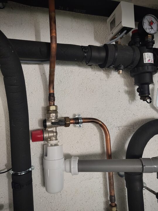 SFR DHW safety group and discharge siphon. Potable safety-group close-up.